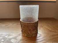 Full view of candle holder standing upright on table