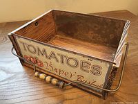 Front angled view of crate showing graphic panel and handle