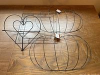 Group view showing heart stand, three rectangular frames, two pumpkin frames