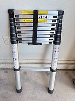 Ladder collapsed and strapped for storage