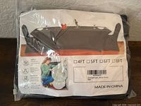 Front of packaged black 6-ft spandex tablecloth