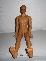 Full view of nude tan resin BJD body laid flat