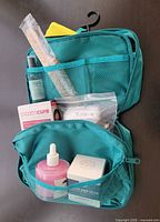 Lot overview showing toiletry bag open with contents