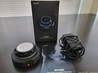 Power supply unit, AC adapter, box, manual displayed on table