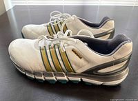 Left and right Adidas Pure360 golf shoes side view