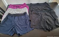 All six pairs of shorts front view laid flat