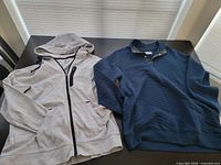 Both garments laid flat showing colors, styles, overall condition