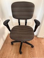 Front view of brown checkered fabric office chair