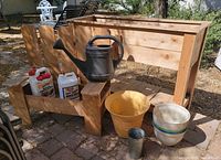 assorted planters, watering can, chemicals