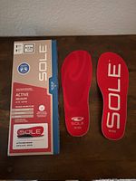 Front view of insoles and retail box