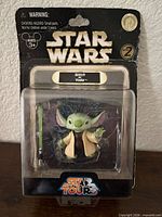 Front view of sealed Stitch as Yoda figure on card