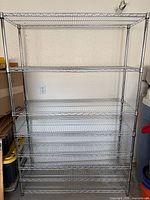 Full frontal view of HDX chrome wire shelving unit showing seven shelves and overall structure