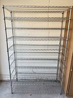 Front view of steel wire shelving unit showing nine shelves and top shelf.