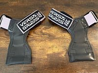 Pair of Versa Gripps Fit Pro grips laid flat showing front view