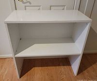 Front view showing open two-shelf design