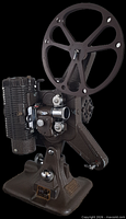 Side view of Keystone Model A-8 projector showing reel arm, lens, motor and base