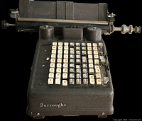 Front view of Burroughs adding machine showing keypad and carriage