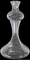 Full view of clear glass decanter with stainless steel mesh aerator inserted in neck