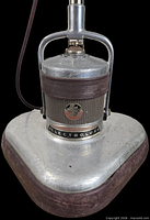 Front view of Electrolux floor polisher showing badge, housing, base and pad