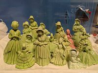 Front view showing all 16 ceramic lady figurines