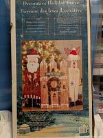 Box showing full image of Decorative Holiday Fence set with Santa and reindeer