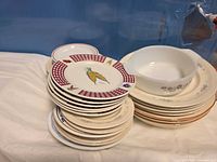 Overall view of stacked Corelle plates and Dynaware casserole