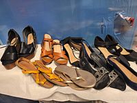 Overall lot view of seven pairs of footwear