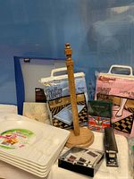 Group shot showing bath mats, paper towel holder, binder, tray, stapler, cards, puzzle, slide mounts