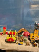 Overall view of assorted toys on table