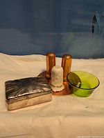 Group view of trinket box, copper shakers, ceramic shaker, glass bowl and copper coaster