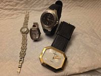 All four wristwatches displayed together