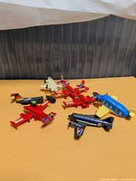 All eight Kinder Surprise airplanes arranged on surface