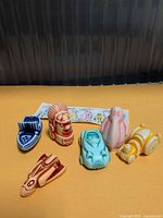 all six Kinder Surprise toys and paper insert displayed