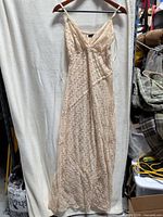 Full front view of lace maxi dress on hanger