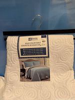 Front view showing Home Beyond label on quilt