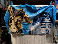 Full view of cover-up showing R2-D2 and C-3PO design