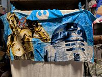 Front view of hooded cover-up showing full Star Wars graphic and hood