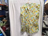 Full view of floral apron hanging