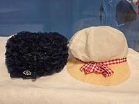 Two hats side by side showing front and colour