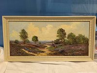 Full view of framed landscape painting