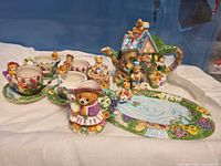 Overall view of tea set showing teapot, cups, saucers, creamer, sugar and tray