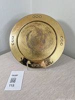 Full view of brass tray upright showing size and design