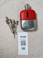 Flask front and six cocktail picks overview