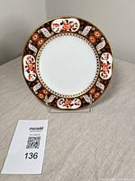 Full front view of plate on stand with lot tag visible