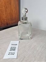 Full view of square crystal decanter with stopper
