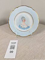 Full view of porcelain plate on stand showing overall design and size