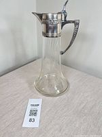 Full view left side showing silver-plate mount and cut-glass body