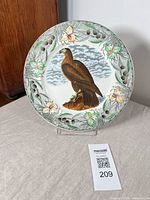 Front view of Adams Bird of Washington plate on stand