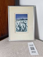 Front view of framed etching showing artwork, mat, and frame