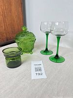 All four green glass items grouped